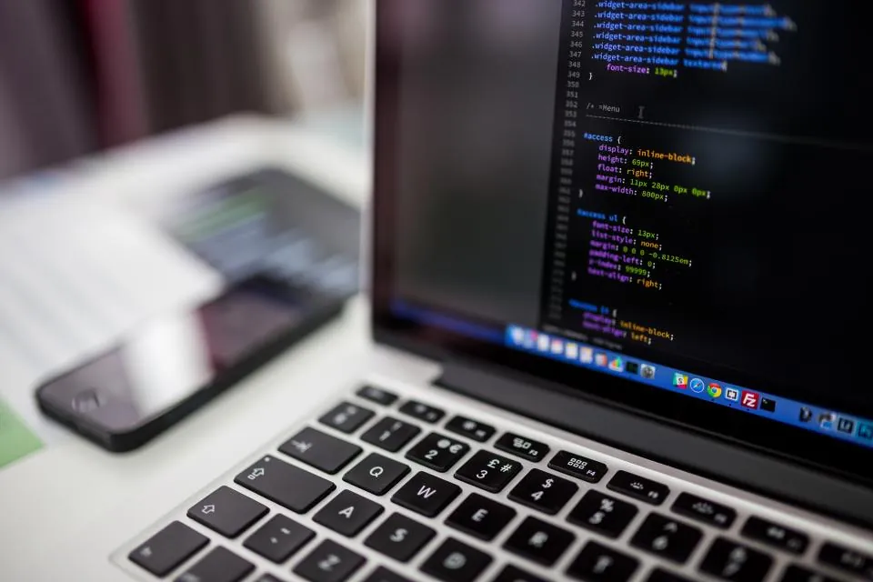 Laptop showing source code